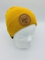 Preview: Hipster Beanie in der Farbe Senfgelb mit braunem Label "There is No Planet B"