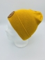 Preview: Hipster Beanie in der Farbe Senfgelb mit braunem Label "There is No Planet B"