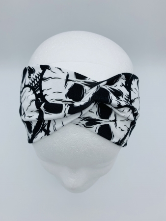 Stirnband aus Baumwolljersey in der Farbe Weiß mit schwarzen Totenköpfen